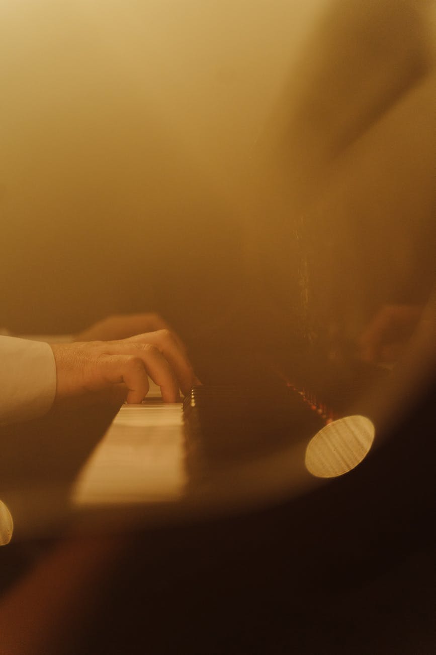 close up shot of a person playing piano